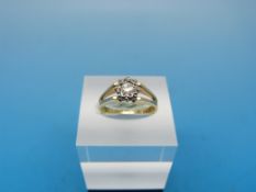 An 18ct gold ring set with a diamond in an illusion setting