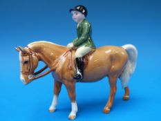 A Beswick boy on a palomino pony
