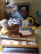 A box of assorted games including an unopened Fifty Shades of Grey party game, Remy Martin game,