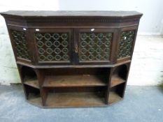 A stained glass bookcase/ display cabinet, possibly Liberty, with bullseye stained glass (W125, D28,