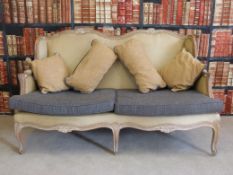 A French limed oak six legged sofa