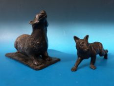 A bronze coloured sculpture of a badger by Addison  together with another of a fox