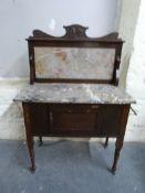 A marble topped and tile backed washstand (W76, D43,