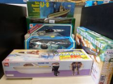Four boxed model boats comprising Yamaha speed boat, Sea Eagle speed boat,