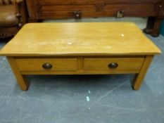 An oak coffee table with two drawers to side (L110, W56,