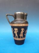 A Doulton Lambeth stoneware jug with Egyptian style decoration and hallmarked silver rim