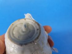 A first period Worcester relief moulded butter boat with hand painted flower decoration (largest