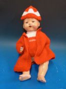 An Armand Marseille bisque headed doll with open mouth and weighted blue eyes,