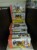 A collection of excavator models in boxes