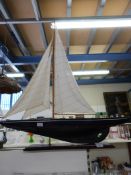 A wooden model of a pond yacht