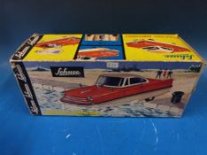 A boxed Anker battery powered submarine together with a Schuco electric amphibious model car,