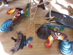 Two cast cockerel welcome signs and similar style weather vane
