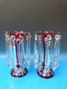 A pair of flash overlaid cut ruby glass lustres, 27cm tall.
