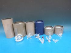 Seven Swarovski crystal animals and animal groups comprising a beagle playing, lion cub, clam, cat,