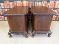 A pair of mahogany office cupboards, each opening to reveal three slide out trays,