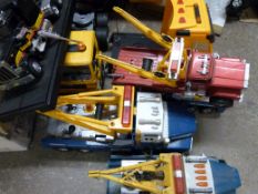 A collection of large scale model lorries some battery operated.