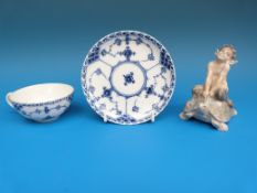 A Copenhagen faun riding a tortoise and a Copenhagen cup and saucer