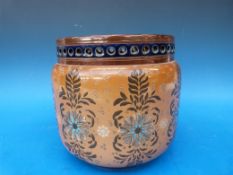 A Doulton Lambeth pierced stoneware jardiniere decorated with flowers and initialled to base EW and