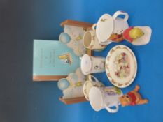 A collection of Winnie the Pooh, Bunnykins and other related items to include ceramics, bookends,
