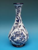 A Moorcroft blue on blue pottery vase, 23.