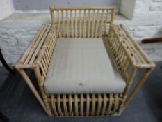 A pair of cane conservatory chairs