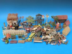 A collection of lead farm animals and figures together with a Schuco clockwork tumbling mouse etc