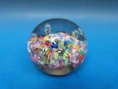Paul Ysart harlequin glass paperweight with suspended bubbles above scrambled canes.