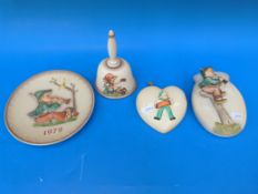 Three Hummell and one similar item to include two wall pockets a 1979 plate and a bell,