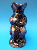 A Measham type Toby taking snuff (24cm tall)
