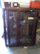 A late 19thC mahogany bookcase with astragal glazed doors (missing base section).