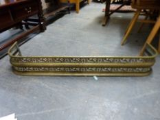 A brass pieced fire guard