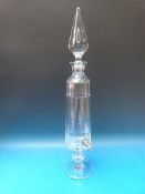 A Val St Lambert glass apothecary decanter with brass tap, the body and stopper with faceted sides,