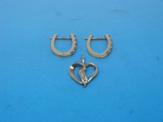 A pair of 14ct gold diamond earrings and a diamond pendant