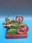 A twin cylinder steam engine with twin flywheels,