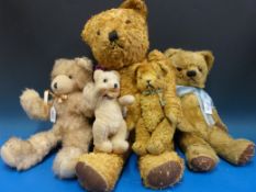 Five vintage bears, one mohair and one straw filled , the largest 60cm tall.
