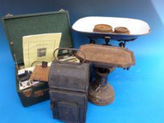 A set of scales marked 'The Acme', a B.