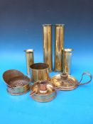 A collection of brass shell cases and trench art