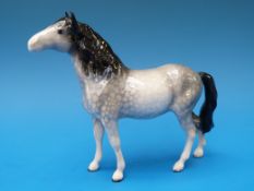 A Beswick pony in dappled grey colourway.