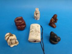 A collection of netsukes and similar items.