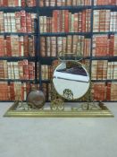 A brass mirrored fire guard,