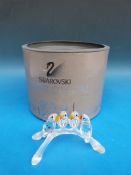 Swarovski crystal model of four lovebird chicks on frosted branch,