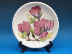 A Moorcroft charger in 