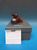 Daum glass puppy on purple glass ball, signed to the base Daum France (9cm long,
