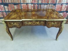 A Louis XV style kingwood desk or side table having marquetry line and floral inlay,