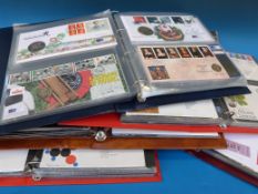 Five albums of first day covers and an album of numismatic covers