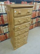 A pine chest of drawers / tallboy with seven drawers