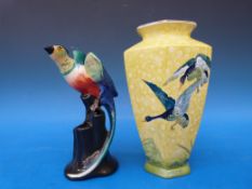 A Wilkinson pottery flower frog, with bird finial,