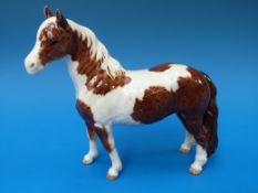 A Beswick skewbald pinto pony