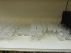A suite of Tutbury cut glass to include champagne flutes, brandy glasses, tumblers, hock glasses,