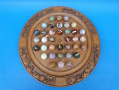 Hand-carved solitaire set with various stones and agates as markers